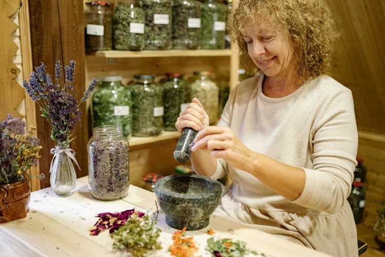 Team member preparing botanicals in the workshop